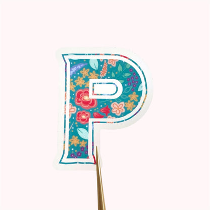 Decorative letter 'P' sticker with floral pattern on a white background