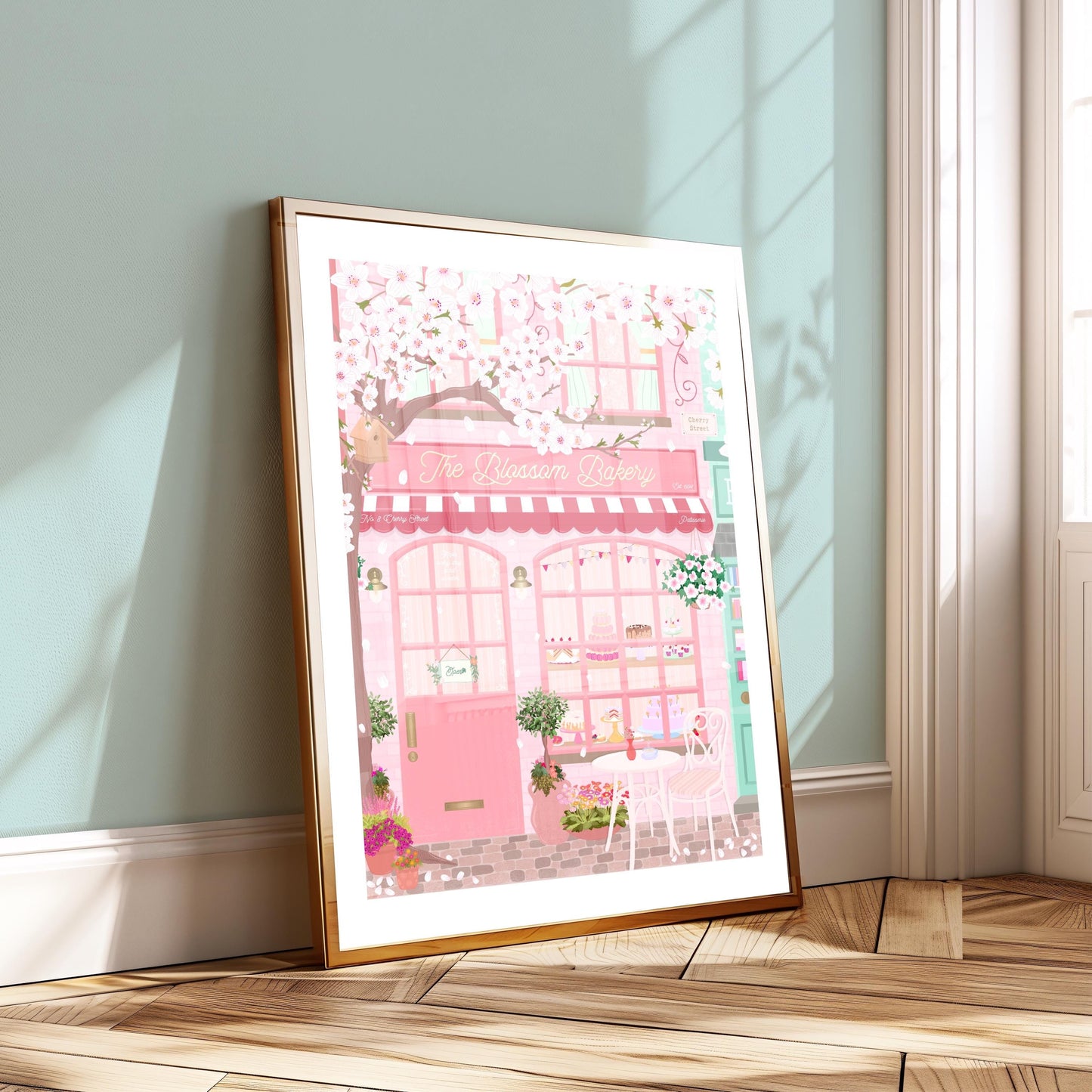 Framed illustration of a pink bakery covered in white cherry blossoms