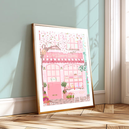 Framed illustration of a pink bakery covered in white cherry blossoms
