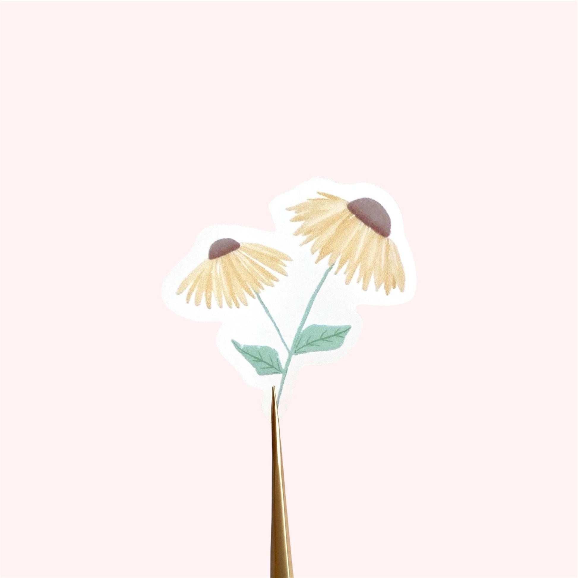 A sticker with 2 yellow daisies against a pink background.