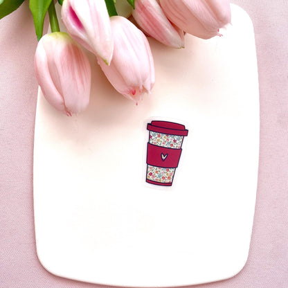 Floral coffee cup sticker on a white plate with pink tulips