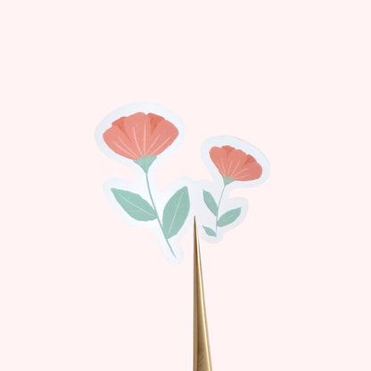 Pink flowers sticker against a cream background.