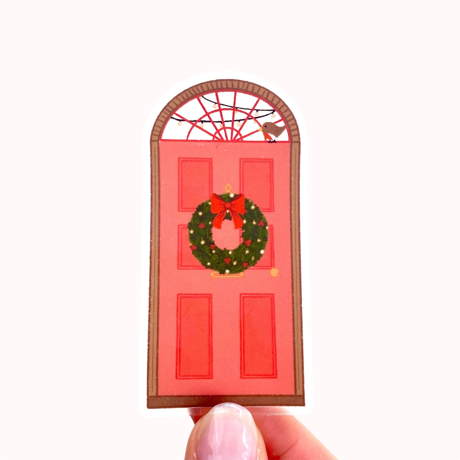 Red door sticker with a wreath and bird on a white background