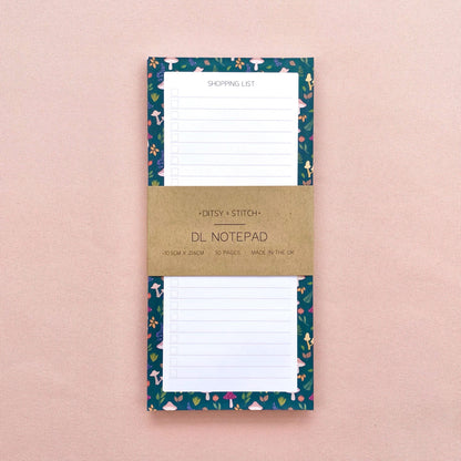 Autumn foliage-patterned shopping list notepad on a pink background