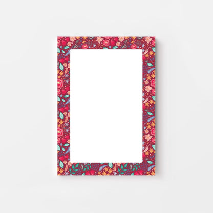 Pink floral patterned bordered notepad on a white background
