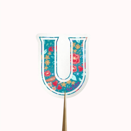 Decorative letter 'U' sticker with floral pattern on a white background