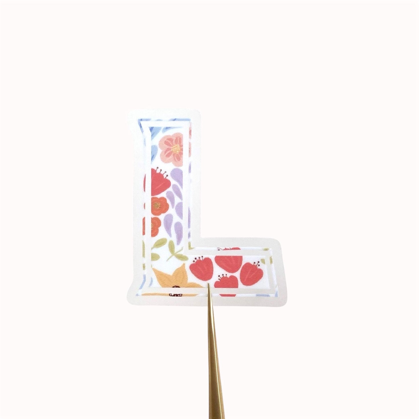Letter 'L' shaped sticker with floral design on a white background