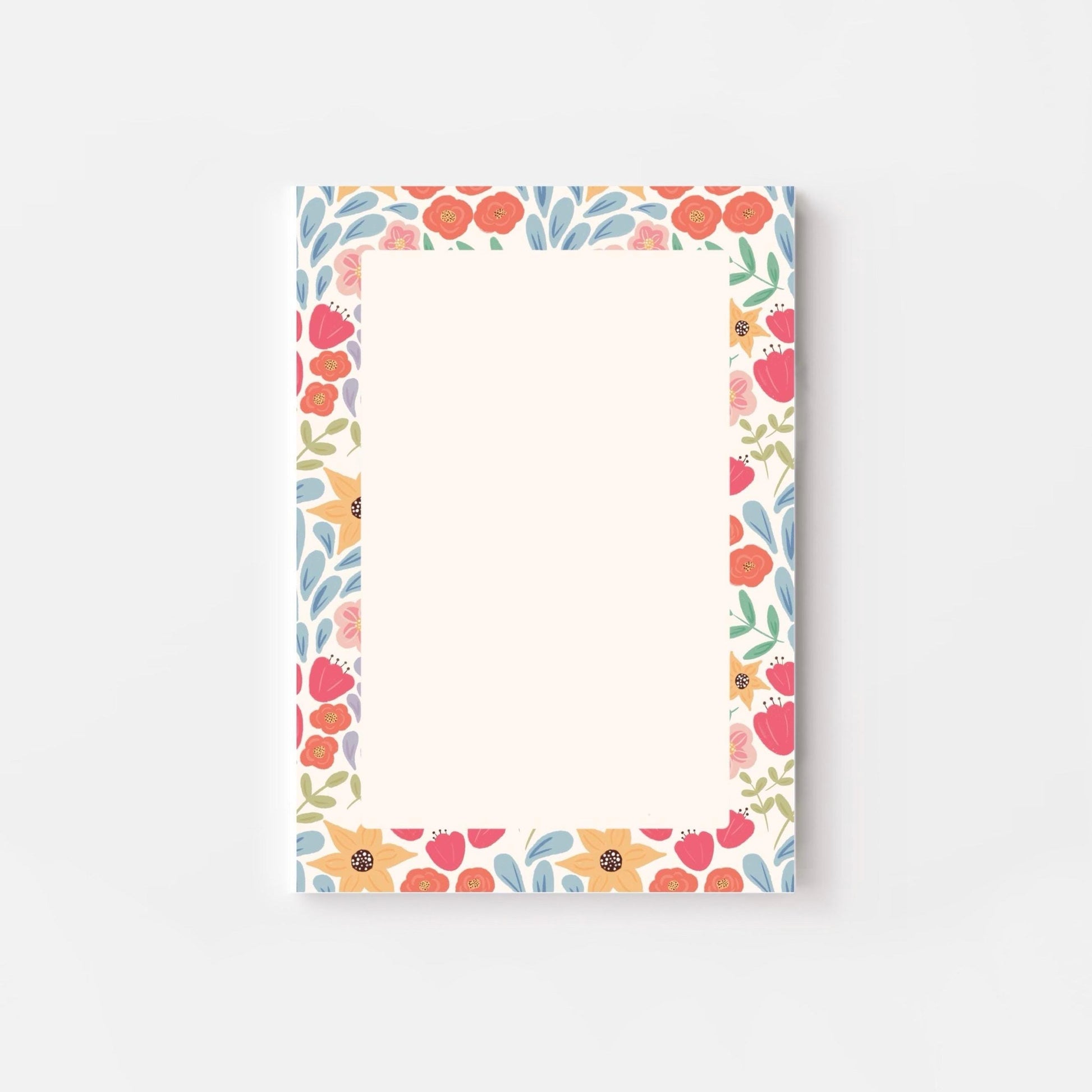 Floral patterned notepad on a white background