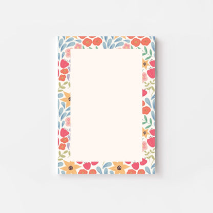 Floral patterned notepad on a white background