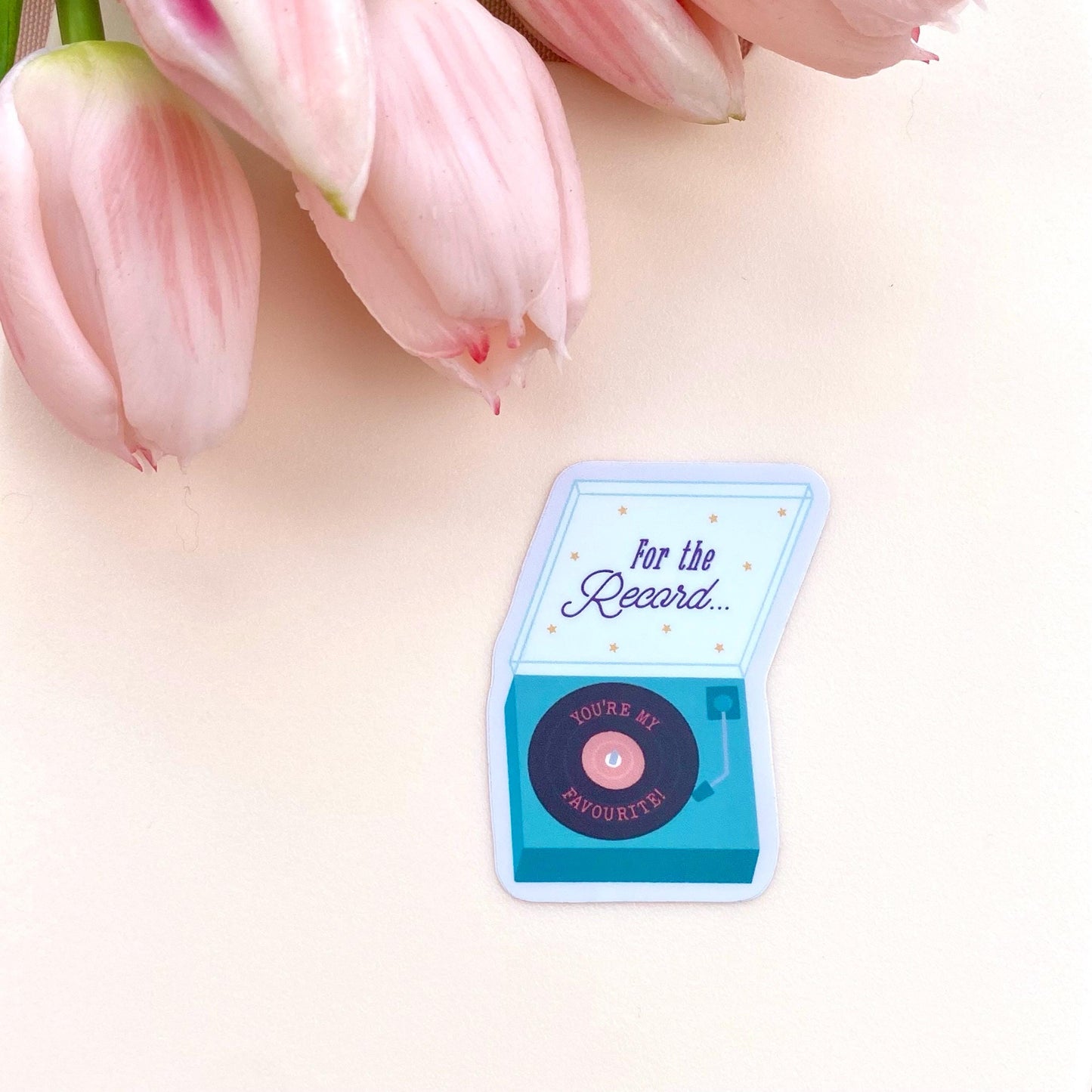 Small blue and pink record player sticker with 'For the Record... you're my favourite' text on a light background with pink tulips.