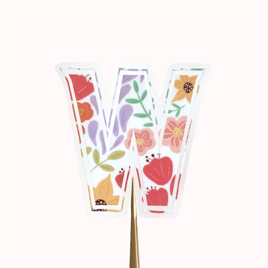Letter 'W' sticker with floral design on a white background