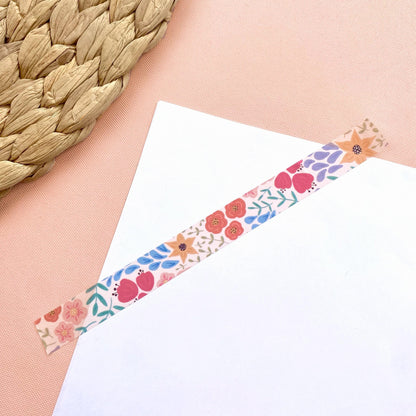 Floral decorative tape on a white card with a woven mat background