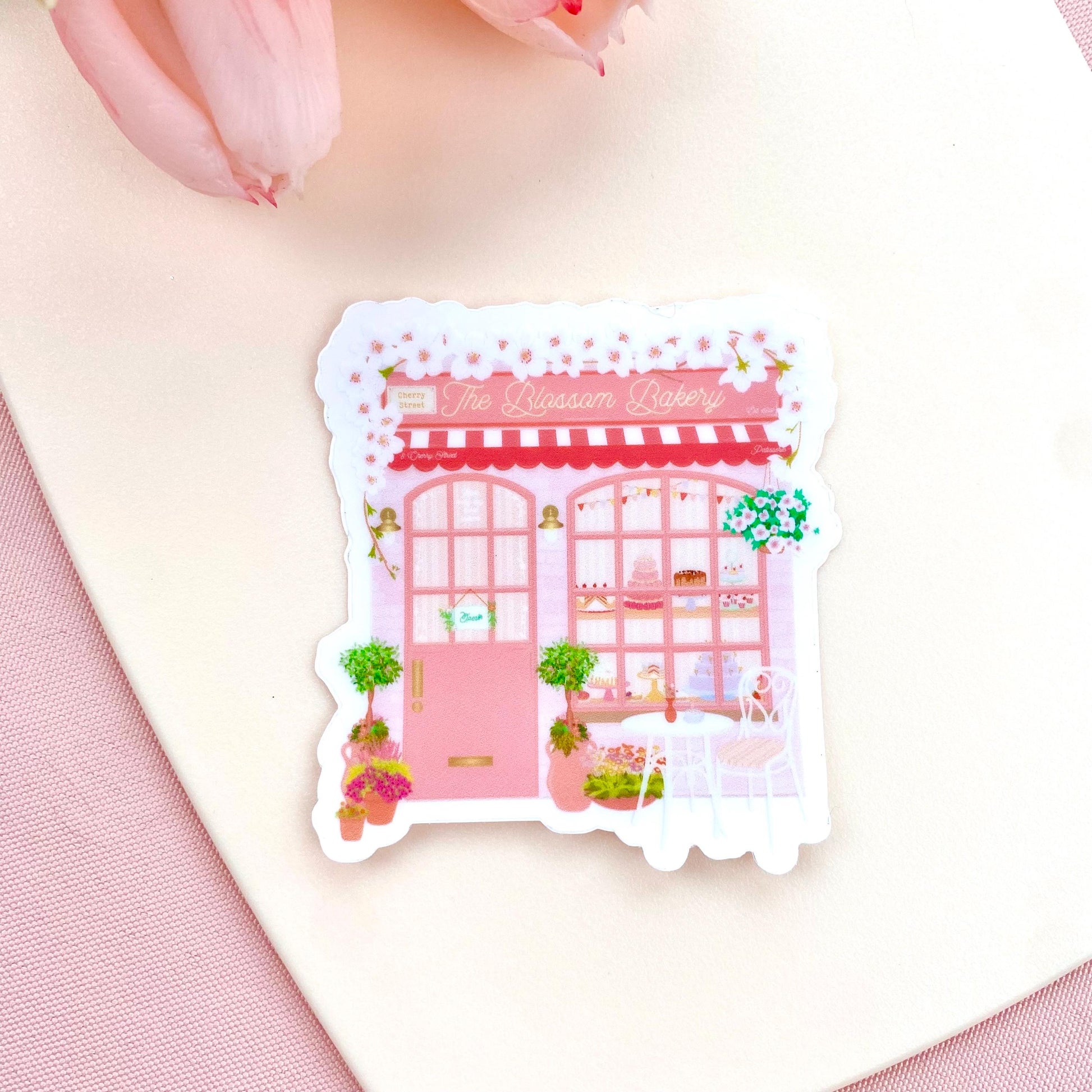 Sticker of a pink bakery with decorative elements on a white background