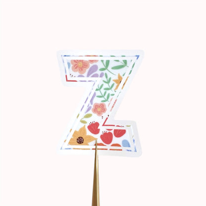 Decorative letter 'Z' sticker with floral patterns on a white background